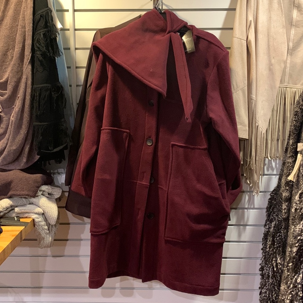 Purple coat never before worn made from recycled water bottles